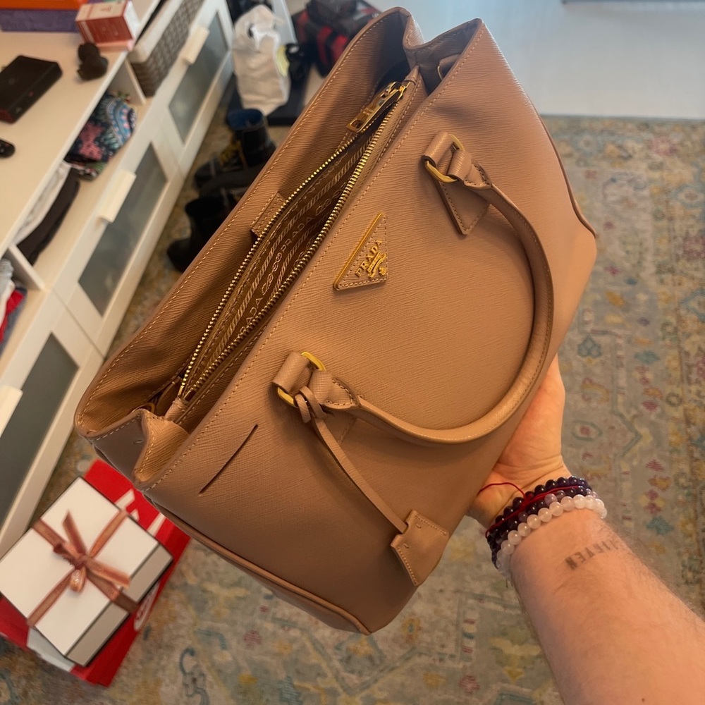Prada saffiano bag , 100% authentic with dust bag RARE barely used, no scratches